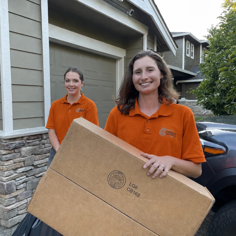 Sorting junk after garage cleanout in Brier