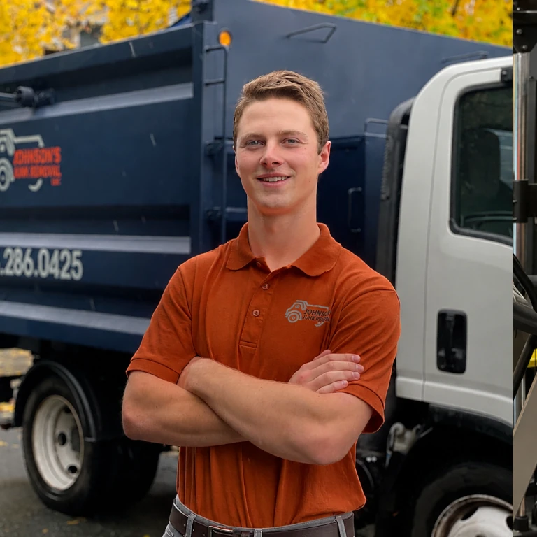 Johnson's Junk Removal professional posing next to their truck