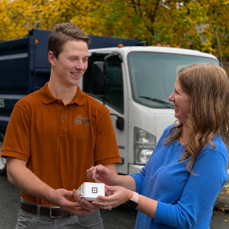 Junk removal professional explaining the process of junk removal