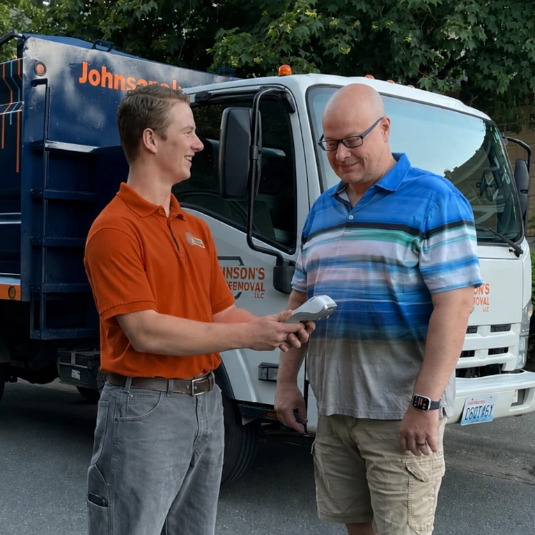 Junk removal professional explaining the process of junk removal